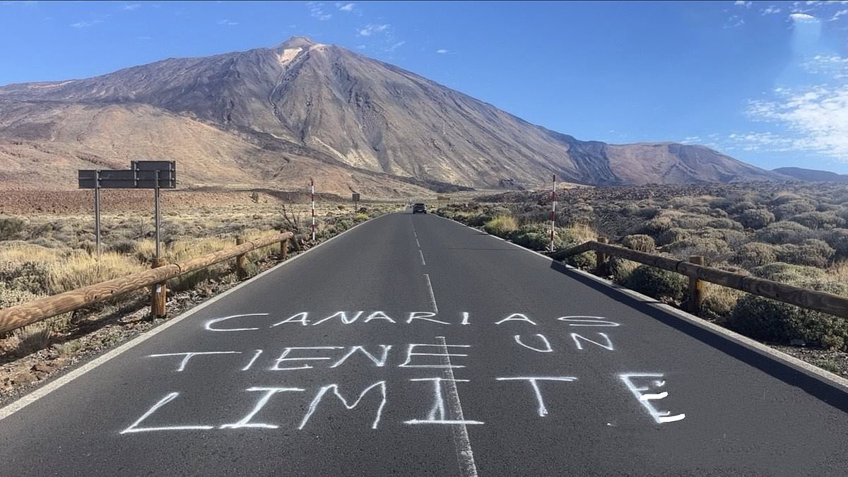 ‘The Canary Islands have a limit’: Latest anti-tourist graffiti appears beneath Tenerife’s iconic Teide volcano after official told Brits looking for cheap holidays to go elsewhere [Video]