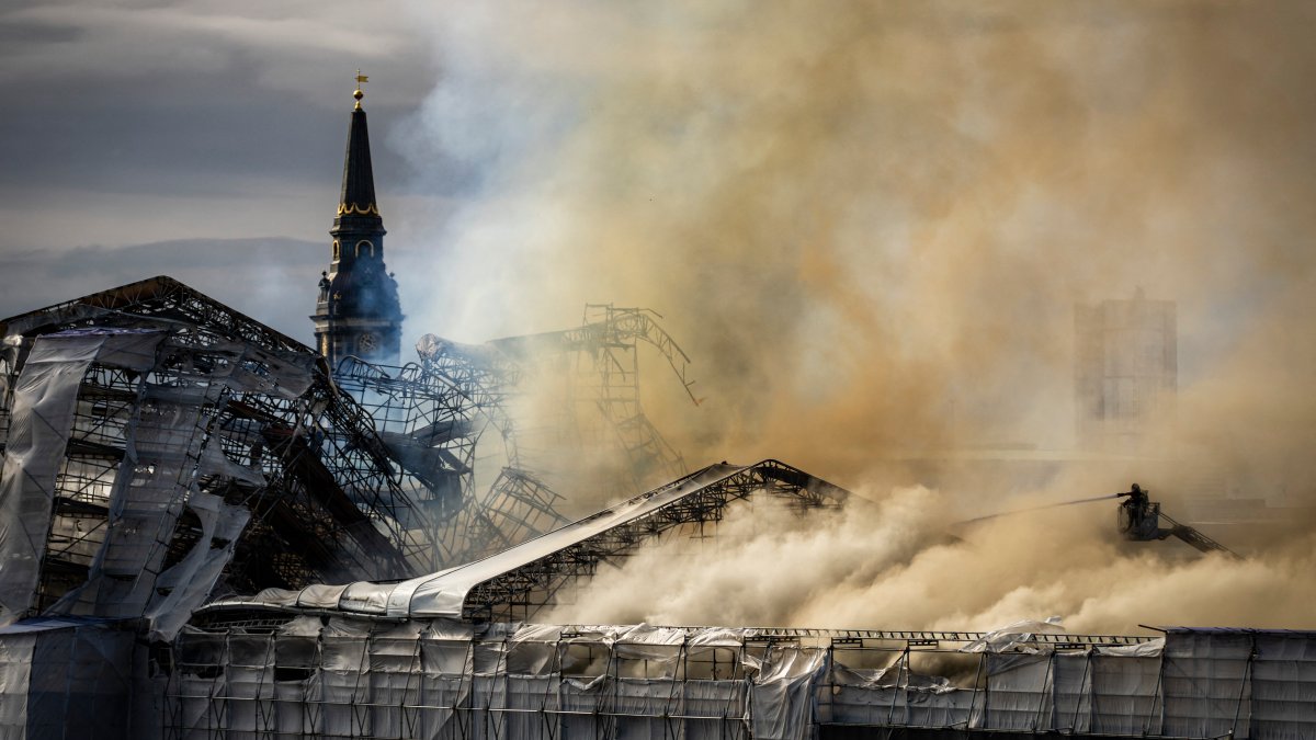 Fire roars through one of Copenhagens oldest buildings, collapsing its spire  NBC10 Philadelphia [Video]