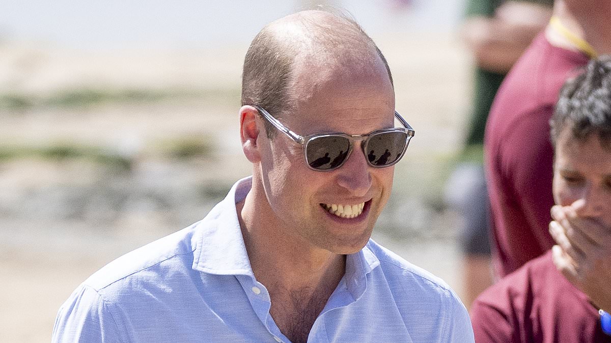 Prince William rocks his shades as he visits a surf beach in Cornwall – before showing off his volleyball skills in an impromptu game [Video]