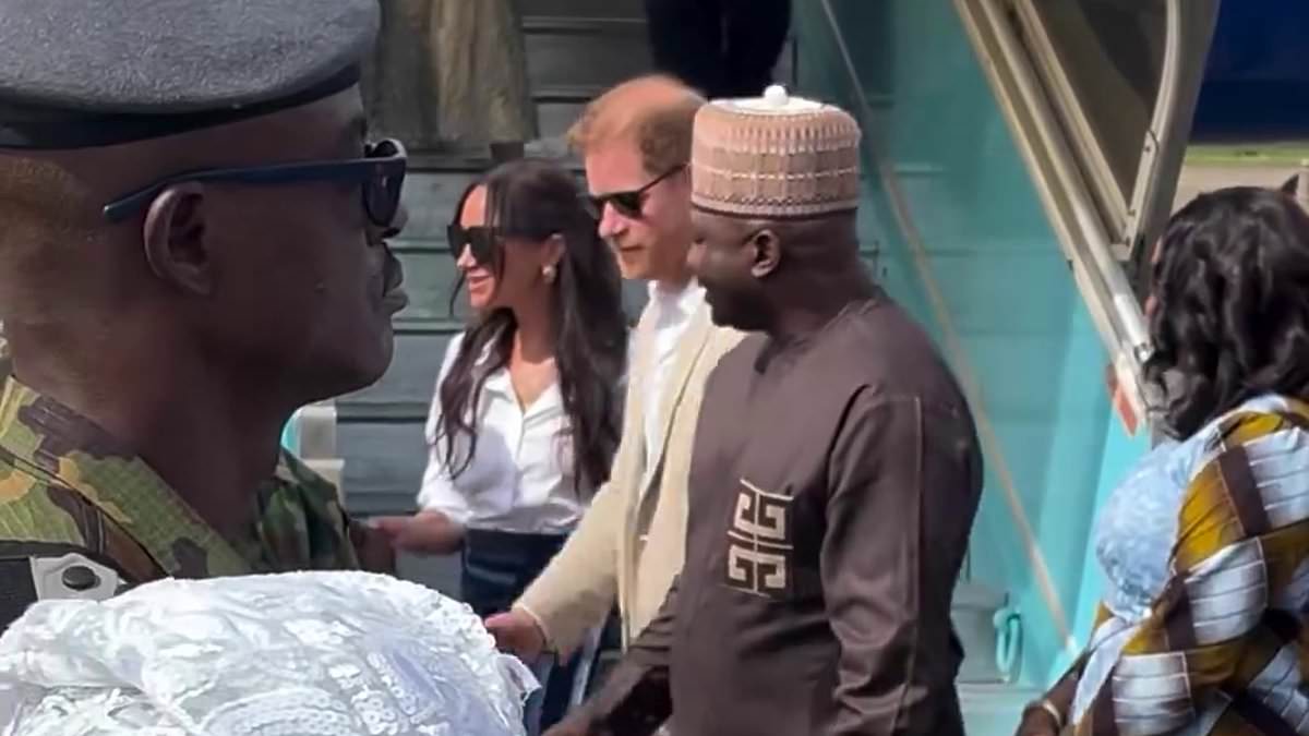 Harry and Meghan are greeted on the runway by Nigerian dignitaries and a dance performance as they touch down in Lagos on third day of their tour – with Duchess wearing hand-woven skirt she was gifted at lavish lunch in Abuja yesterday [Video]