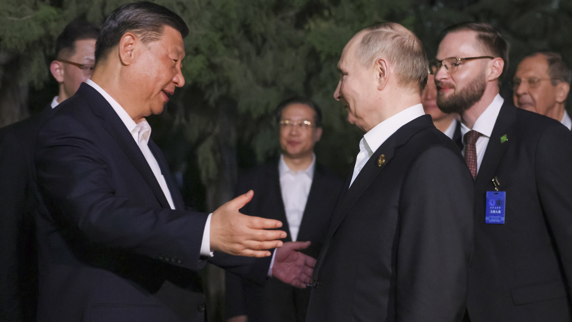 Bizarre moment Xi and Putin go in for TWO HUGS in unprecedented touchy-feely embrace during despots love-in talks [Video]